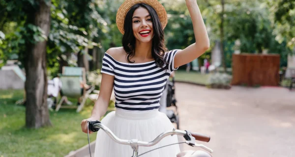 excited-tanned-lady-expressing-happy-emotions-summer-weekend-spectacular-young-woman-with-bicycle-chilling-outdoor