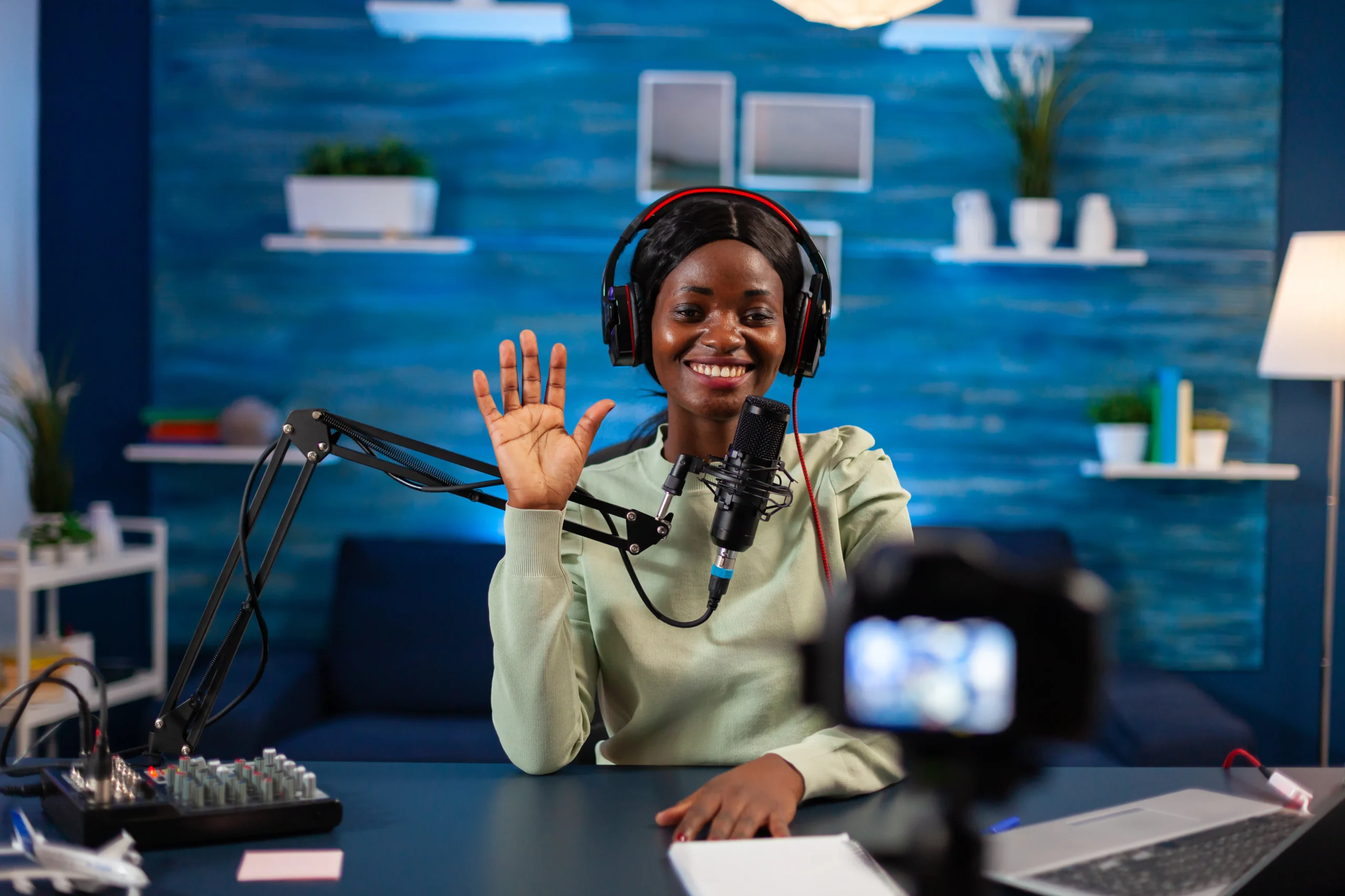 african-blogger-waving-audience-while-filming-podcast-air-production-internet-broadcast-host-streaming-live-content-recording-digital-social-media